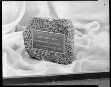 Brass plaque commemorating the dedication of Lake Thomas A