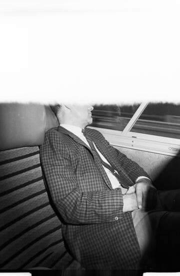 Men taking a chartered bus to The Biltmore Hotel for an off-site meeting