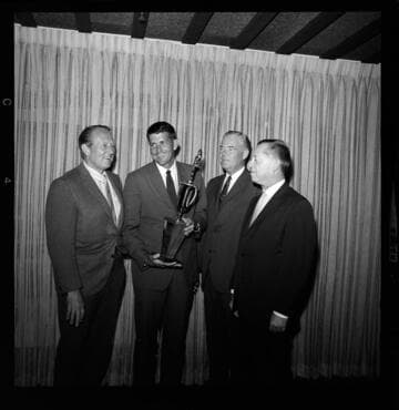 Awards presented to groups of men for Medallion Home building projects