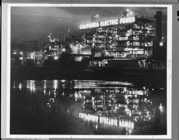 Highgrove Steam Plant at night with reflection in pool