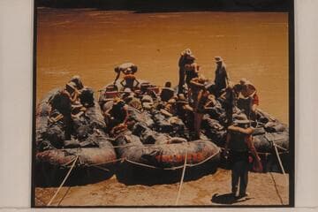 Georgie White's 3-boloney outfit. Through the Grand Canyon; photo made as they were negotiating President Harding Rapid