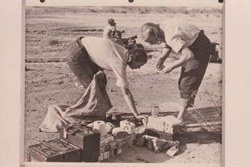 Anne and Zoe Desloge clean up after breakfast at Pierces Ferry.  Margaret Marston in background