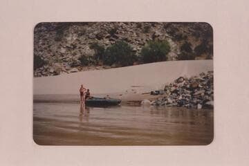 Elgin Pierce and Georgie White waiting at Vulcan Rapid for the Mexican Hat Expedition