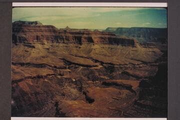 Up the canyon from on or near the Bass Trail. Similar terrain to view on page 196 of Holmes, which is captioned "From the Grand Scenic Divide."