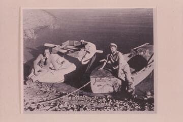 Amos Burg on the rubber raft and Holmstrom on his boat "Julius."  The "Julius" was named for Julius F. Stone, who sent Holmstrom $500 to aid in the expenses of the trip.  Lake Mead