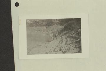 Stone's visit to Glen Canyon. Six men at edge of river