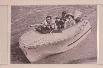"DONZ", the wizard hull powered with outboard motor used by Don Harris on the Yampa and upper Green Rivers in 1954. In the boat: Don Harris, Barry White, Harry Ishimatsu and Mary Lou White