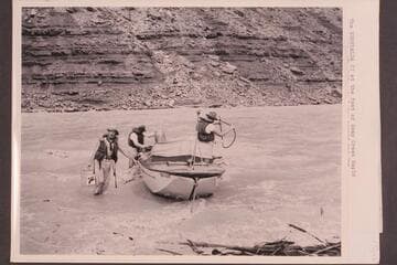 The "Esmeralda II" at the foot of Soap Creek Rapid.  The bilge is being pumped and gas cached for a possible run up the Canyon.  The craft is now at the Visitors Center at Grand Canyon National Park