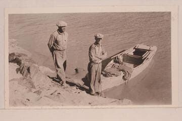 Harry Simpson and Merrill Spencer with their remaining boat at Bright Angel Creek where they left the River after their trip down from Lees Ferry.  One boat was lost in Grapevine Rapid