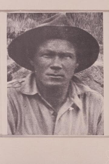 Harry Tasker at camp at Rapid #37, 21.7 miles below the mouth of Green River. Cataract Canyon on the Colorado River. Tasker worked with the USGS under direction of Chenoweth in the survey of Cataract Canyon and upper Glen Canyon in 1921