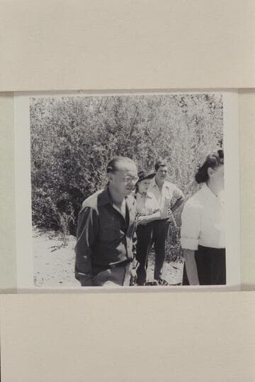 Pres Walker and others watching the landing of the Nevills river party. Jensen