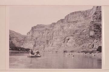 USGS survey trip from Green River, Wyoming, to Green River, Utah.  A feature of the boat operation was the boxes fastened to the hatch covers of the boat operated by Loper.  These provided the seats for Woolley and Trimble.  Four miles below Wash