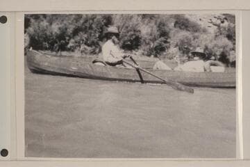 Dave Rust rowing one of his folding canvas boats in Glen Canyon.  George Fraser sits in the stern.  The river journey was from Hite to Lees Ferry