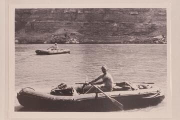 Harry Aleson (near) and Harry Pete Sparkes, Jr., at Green River, Wyoming.  The neoprene boats are the 10-man Navy craft