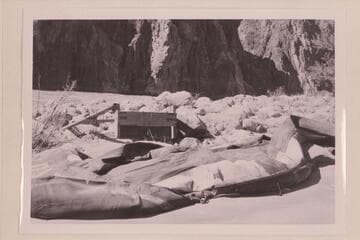 Bus Hatch's boloney left at Bright Angel Creek in 1957 after running from Lees Ferry to Bright Angel in the search for Billingsley. The crude gear in the background is the rig to support the outboard motor