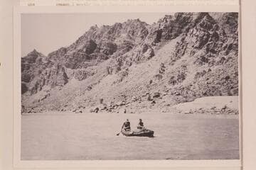 Southwest Explorations in Cataract Canyon. William Dickinson and Jon Lindbergh operating a small inflated unit with paddles. Near Mile 208 1/2