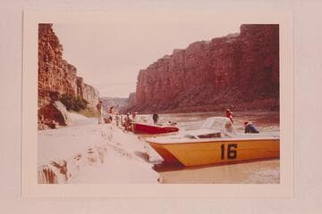 The two 24-ft. Thunderbirds at Mile 4. The "Big Red" fouled rocks at Mile 3 1/2 and is being bailed. After temporary repairs, the trip was abandoned and the boats run back to Lees Ferry