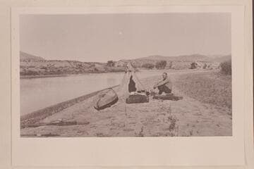 Charles F. Mann, his kayak and tent