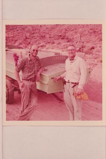 Ed Nichols and Ed Hudson with the inboard boat "Finally"; Lees Ferry after completion of run from Glenwood Springs, Colorado.  The tripod on the stern is a camera rig