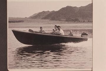Jimmy Jordan at the controls of his Smith-Craft powered with Mercury motor. The Jordan family takes the ride off Boulder City Beach