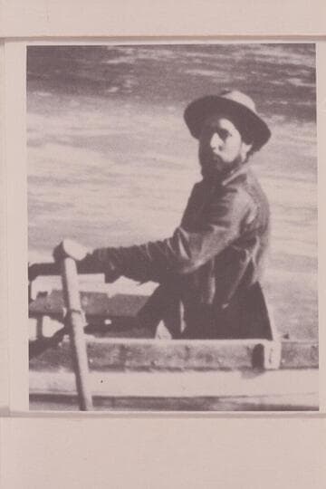 Charles Silver Russell at the oars of the "Utah." Pipe Creek in the Grand Canyon