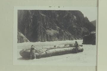 Hank Toll's 27' neoprene pontoon "Mastadon" at foot of Monument Creek Rapid. George Ogura (left) and Hank Toll