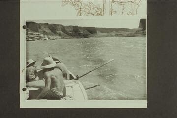 Down Glen Canyon from about Mile 168. Nevills sits in the stern as his "Wen" is driven by a small outboard and tows the two other sadirons. Doris Nevills talks with John Southworth in the cockpit