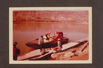Loading the Sportyaks on Tex McClatchy's jet boat for ferrying to the head of Cataract Canyon. Above the highway bridge at Moab