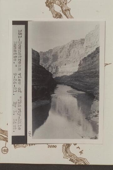 Down to 30 Mile Damsite. Photo in LaRue album 1. Camera is at Mile 186.4 right bank. The fan and riffle at center are at mouth of Cove Canyon at Mile 186.2. This riffle is the one which Stanton dramatized when he announced quitting the survey