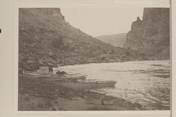 Boats of the Pathe-Bray party at left bank at Mile 204.1. Probably the site of the camp of 1927, Nov. 20-22. Photo was captioned: "below Rapid No. 8."