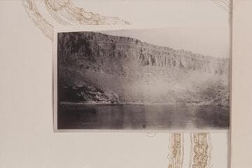 Escarpment of Wingate brought up by the Waterpocket Fold at point where the arch is flat