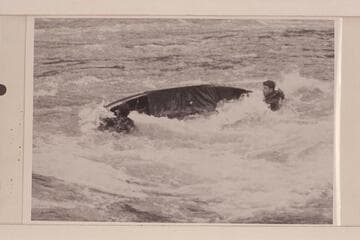 The canoe used in the Rogue River traverse swamps. Appears to be one place where the high canvas deck did not take all the high, curling waves across