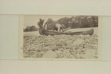 Pete Holt and Joe Evans with their inflated life preservers and the folding canvas canoe. "For himself he had a blown-up football tied to the back of his belt" (p.53)
