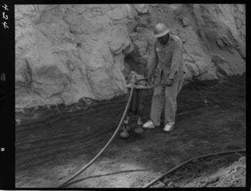 Big Creek - Mammoth Pool - Demonstrating hand operated compacting tools
