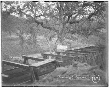 A warning sign that reads: "No trespassing on this ditch. Keep off CT Digger". The sign is on a flume at Kaweah #2 Hydro Plant