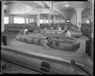 Workers and inflatable boats, Goodyear Tire and Rubber. 1943