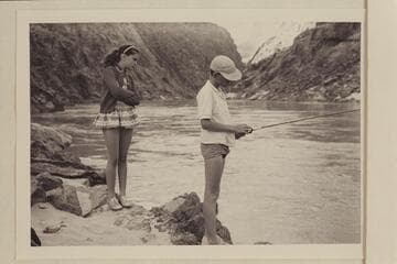 Debbie Marston watches Jeff Marston at fishing. Separation Canyon