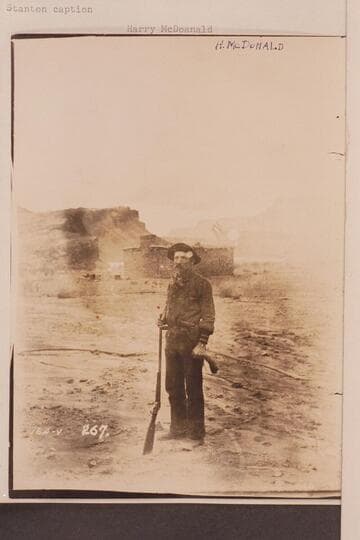Harry McDonald. Behind the fort at Lees Ferry. Stanton caption: Harry McDonald, A Combination of Trapper, Hunter, Miner and Experienced Boatman."