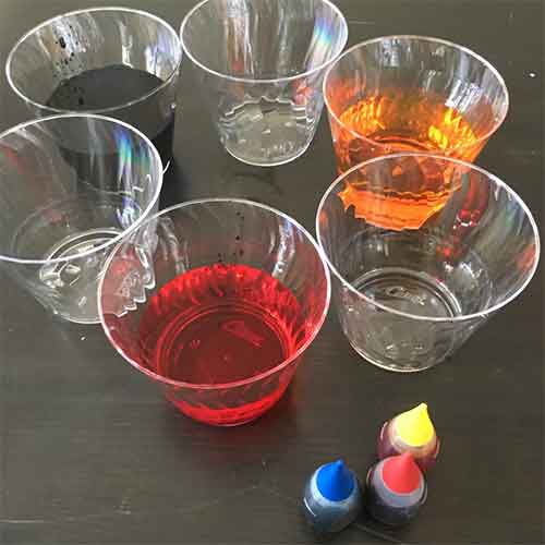 Cups of water with food dye