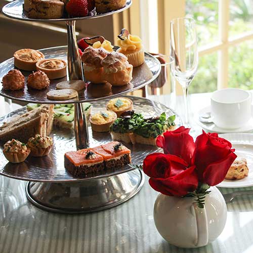 Three tiered platter of afternoon tea treats