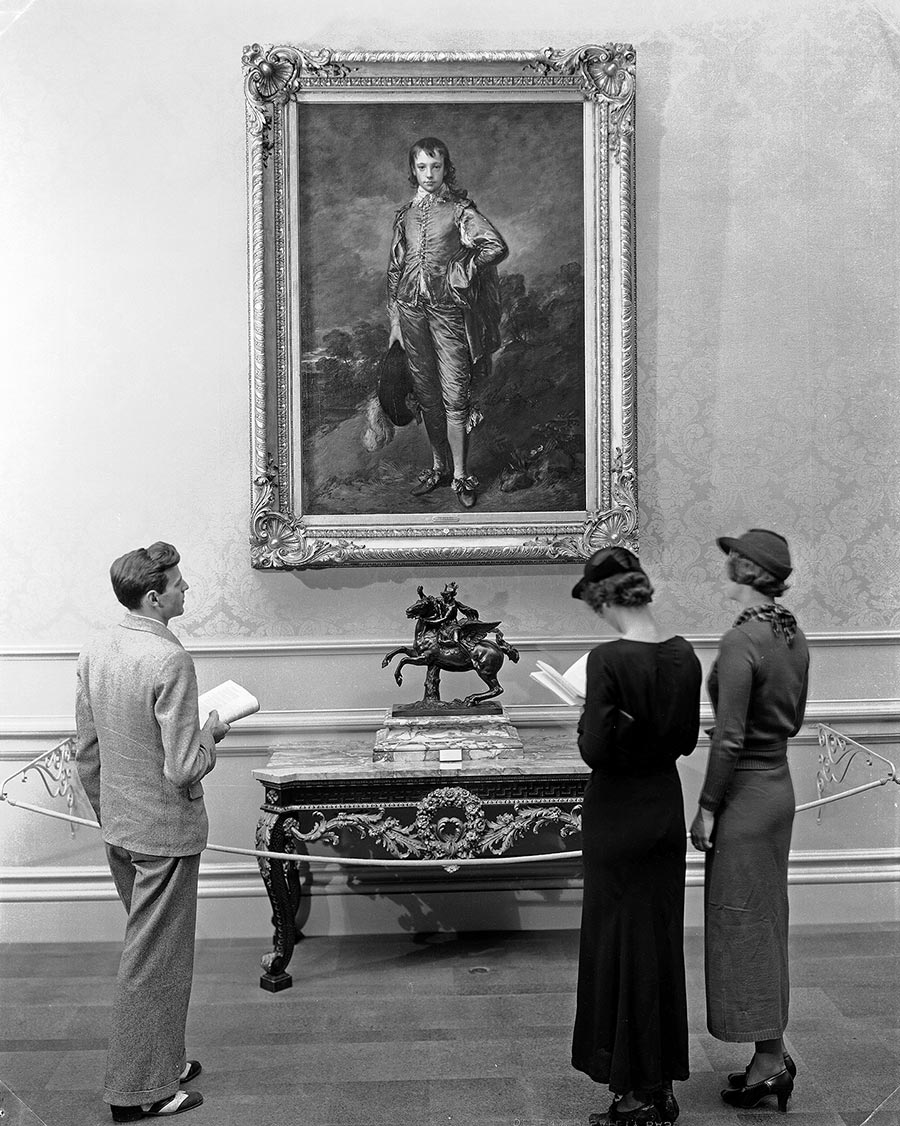 Visitors viewing The Blue Boy at The Huntington in the 1930s
