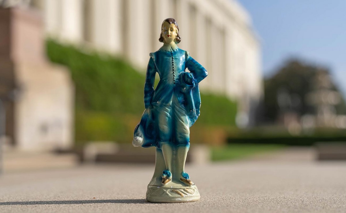 A Blue Boy figurine with the Huntington Library in the background