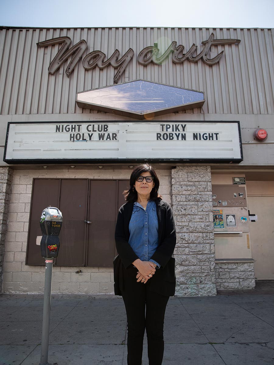 Natalia Molina stands in front of the Nayarit, also known as “Nayarit Primero,” a restaurant founded by her grandmother, Natalia Barraza, in 1952 at 1822 Sunset Boulevard, Los Angeles. Today the building is home to The Echo, a music venue and nightclub. Photo by Zaydee Sanchez.