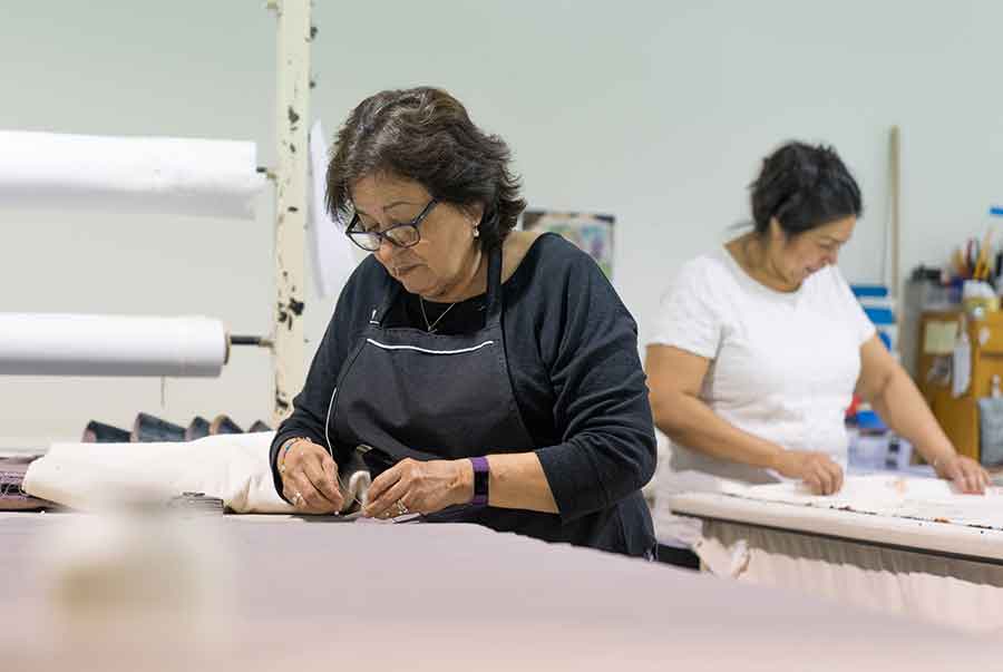 Quinn’s expert staff puts finishing touches on dozens of window treatments