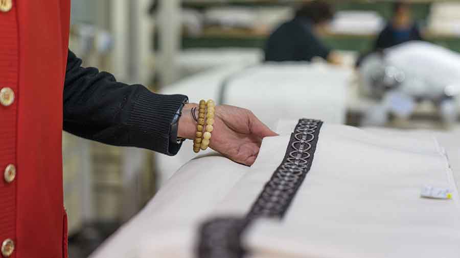 Kathleen Quinn touches one of her company’s handcrafted products