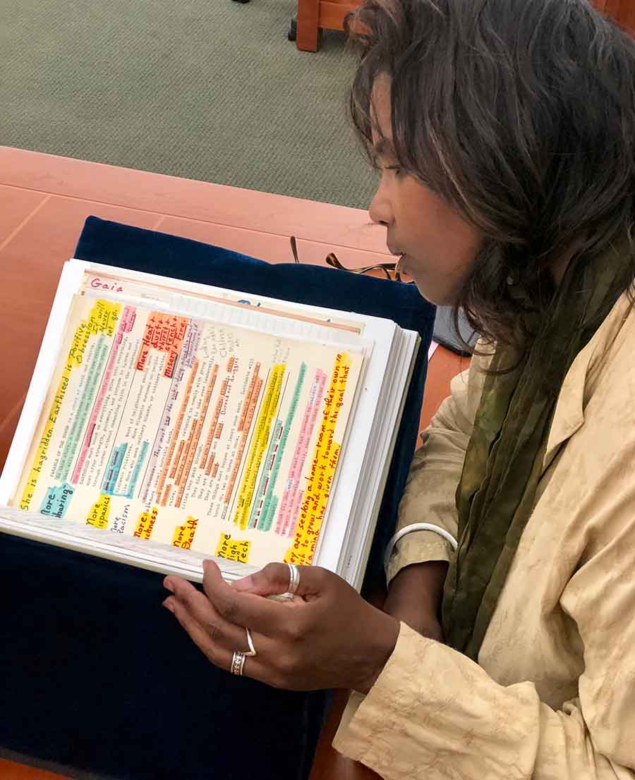 Lynell George examines Butler’s 1989 notes about her novel Parable of the Sower, which was published in 1993, in The Huntington’s Ahmanson Reading Room. The Huntington Library, Art Museum, and Botanical Gardens.