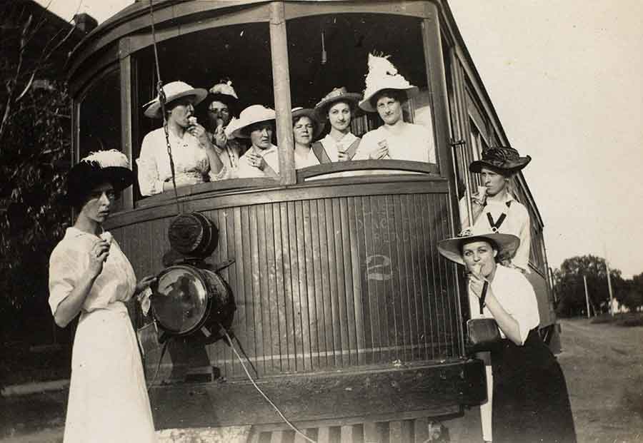 Young women with ice cream cones on a Pacific Electric streetcar, Santa Monica, 1913; unidentified photographer.