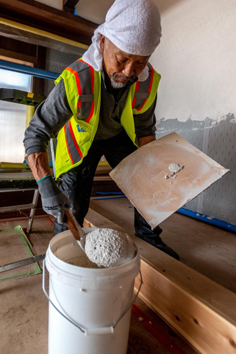 plasterer working on Japanese Heritage House