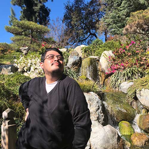Photo in front of waterfall in Japanese Garden