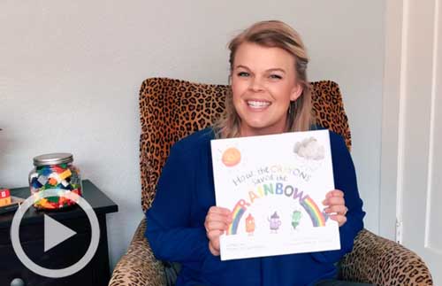 Staff member Joy with How the Crayons Saved the Rainbow book